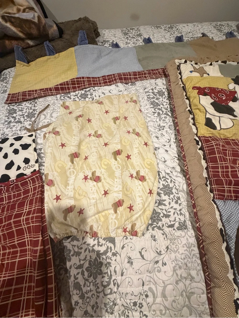 Vintage CoCalo wild west design with a horse and cow 4 piece nursery bedding.